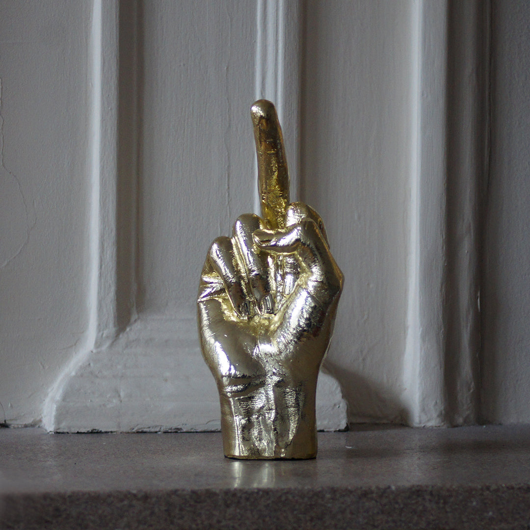 
                  
                    Sculpture main doigt d'honneur dorée
                  
                